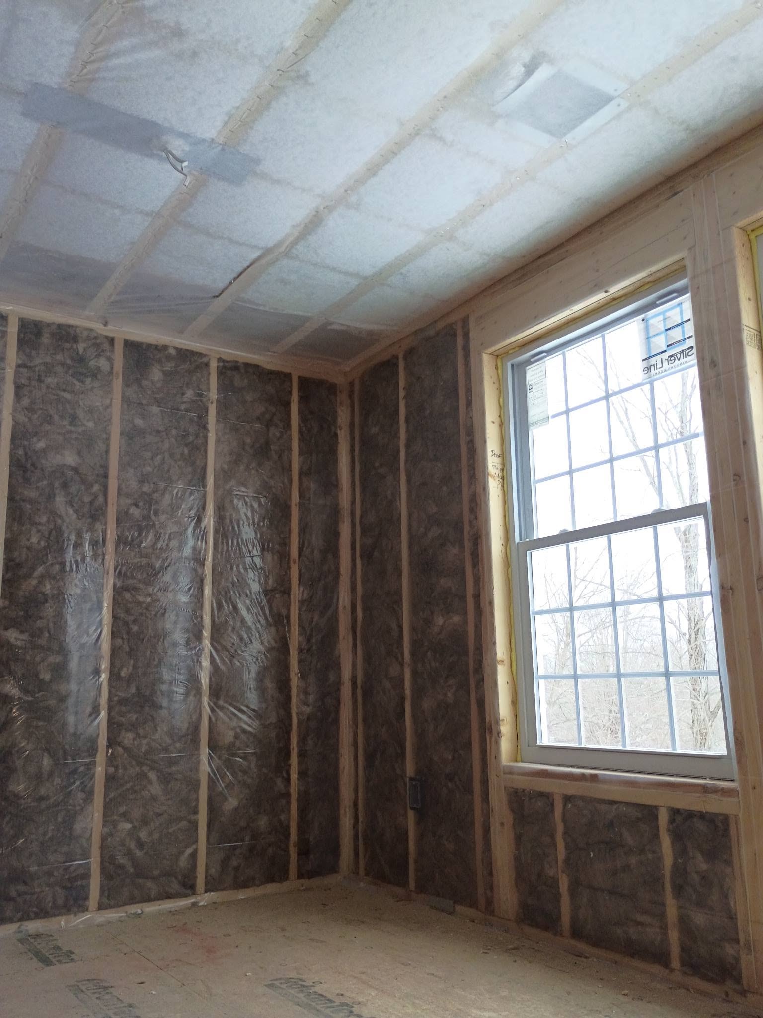 Window wall fiberglass batt insulation and vapor barrier in an Amesbury Massachusetts addition