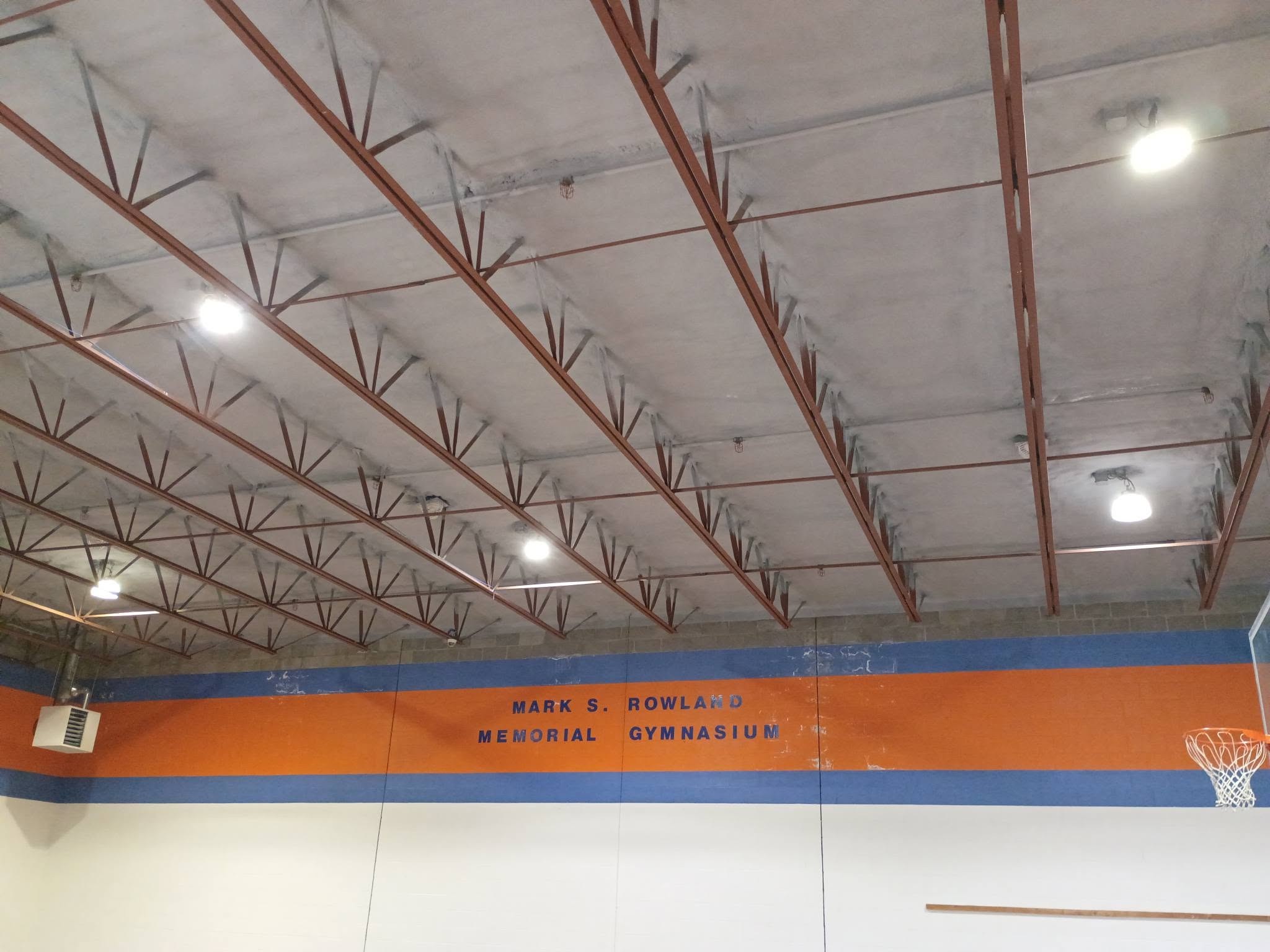 Spray foam insulation installed on the gymnasium ceiling at a Nashua New Hampshire Children's Home project