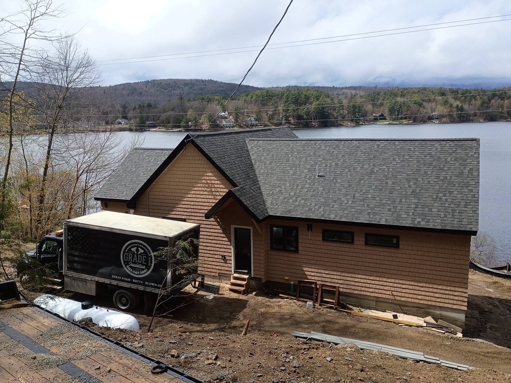 Grade 1 Insulation truck on site at a New Hampshire lakehouse insulation project