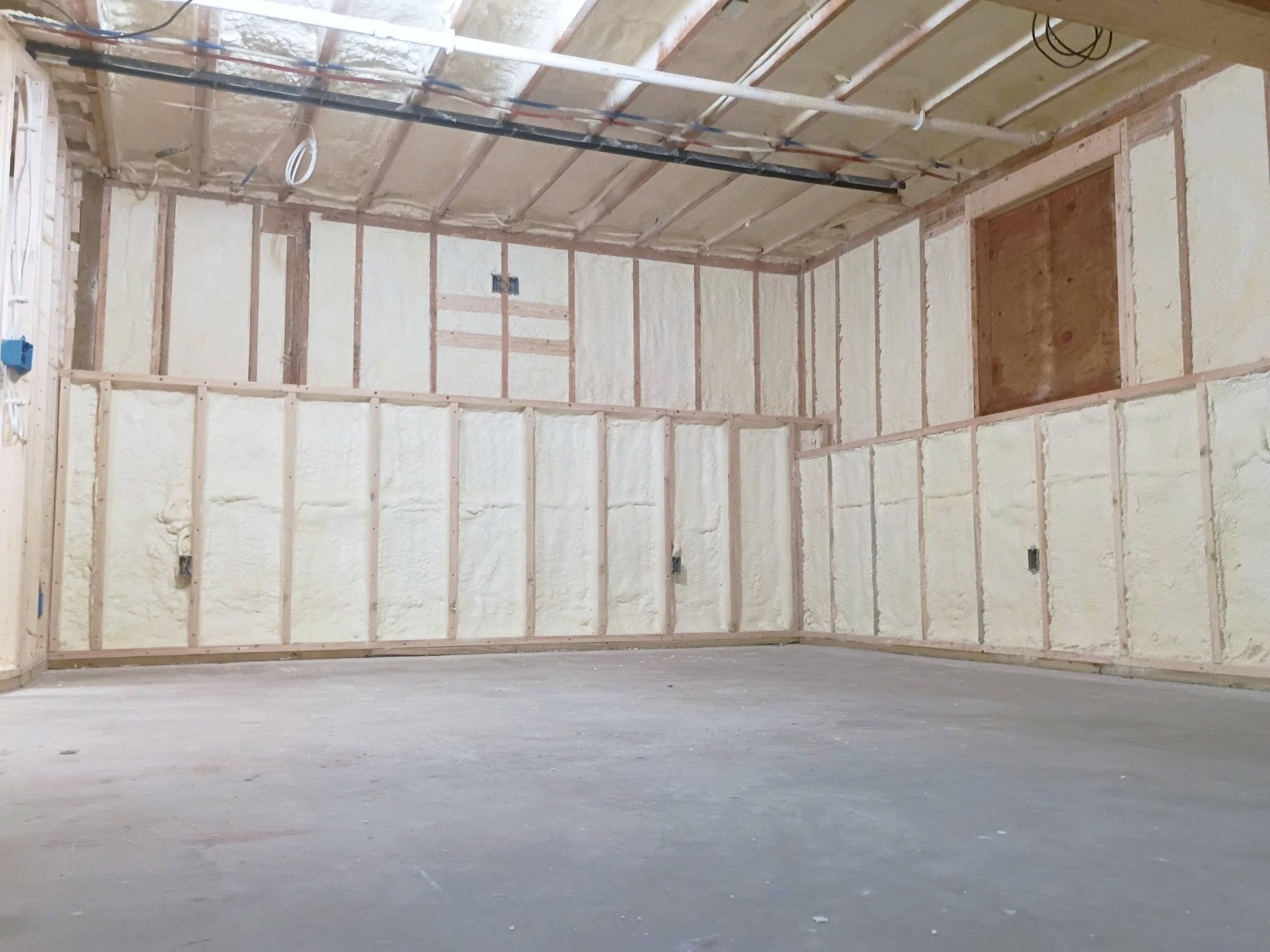 Interior room with spray foam insulation in walls and ceiling areas in New Hampshire